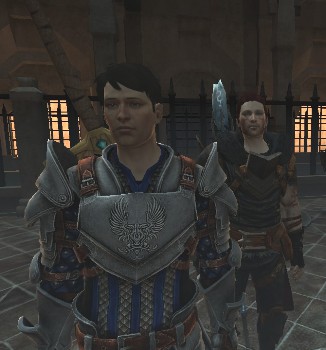 Carver standing in Grey Warden armor, Zel Hawke standing behind, over his left shoulder.